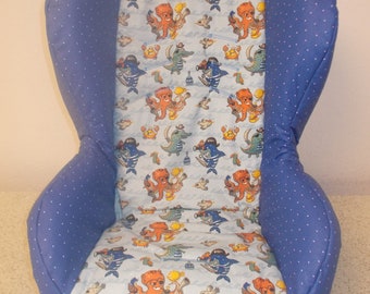 May include: A blue and white car seat cover with a nautical theme. The cover features a pattern of octopuses, fish, crabs, and other sea creatures. The cover is made of a soft, comfortable fabric and is easy to clean.