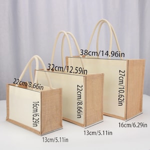 May include: Three burlap tote bags with white fabric lining and rope handles. The bags are different sizes, with the largest measuring 38 inches by 27 inches, the middle bag measuring 32 inches by 22 inches, and the smallest bag measuring 22 inches by 16 inches.