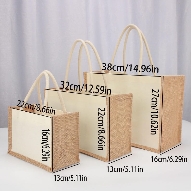 May include: Three burlap tote bags with white fabric lining and rope handles. The bags are different sizes, with the largest measuring 38 inches by 27 inches, the middle bag measuring 32 inches by 22 inches, and the smallest bag measuring 22 inches by 16 inches.