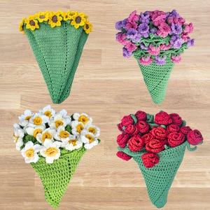 May include: Four crochet bouquets in green cone-shaped holders. The bouquets feature yellow sunflowers, purple and pink flowers, white daisies, and red roses. The handmade flowers are arranged to resemble fresh bouquets.