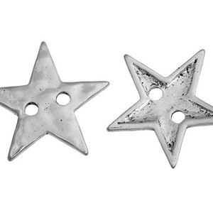 May include: Two silver star-shaped buttons with two holes each.