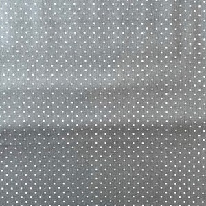 Könnte beinhalten: Nahaufnahme eines grauen Stoffes mit weißen Punkten.