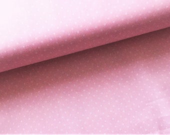 May include: Pink fabric with a white polka dot pattern. The fabric is folded in half, showing the pattern on both sides.