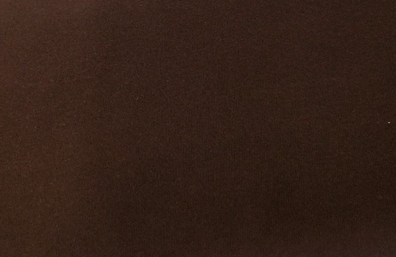 May include: A solid brown fabric with a smooth texture.