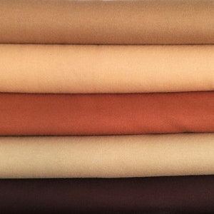 May include: Five fabric swatches in different shades of brown, from light beige to dark brown.