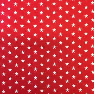 May include: Red fabric with a white star pattern.