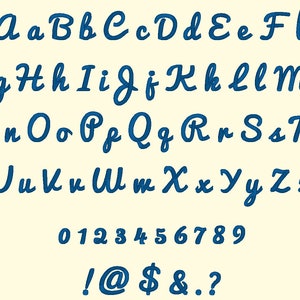 May include: A complete alphabet and number set in a cursive font, rendered in a deep blue color. The letters, numbers, and symbols are displayed on a cream-colored background. The font includes uppercase and lowercase letters, numbers 0-9, and punctuation marks.