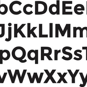 May include: A black and white image of the alphabet in uppercase and lowercase letters. The letters are in a bold, sans-serif font.