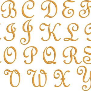 May include: A full alphabet in a gold, elegant script font. Each letter, from A to Z, is displayed with a flowing, cursive design. The letters are evenly spaced and presented against a white background, creating a classic and decorative aesthetic.