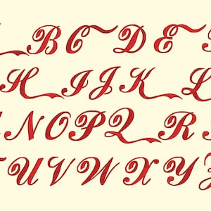 May include: A red cursive alphabet with a stylized font. The letters are all uppercase and are arranged in alphabetical order.