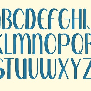 May include: A complete alphabet in uppercase letters, rendered in a teal blue color. The letters are in a sans-serif font with a slightly rounded appearance, set against a cream-colored background. The letters are evenly spaced and clearly visible.