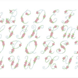 May include: An alphabet of cursive letters with pink floral embellishments. Each letter is outlined in blue and decorated with pink flowers.