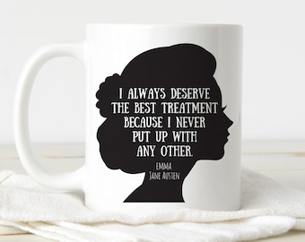 May include: White ceramic mug featuring a black silhouette of a woman's profile and the quote "I ALWAYS DESERVE THE BEST TREATMENT BECAUSE I NEVER PUT UP WITH ANY OTHER." The quote is from Jane Austen's novel, Emma.