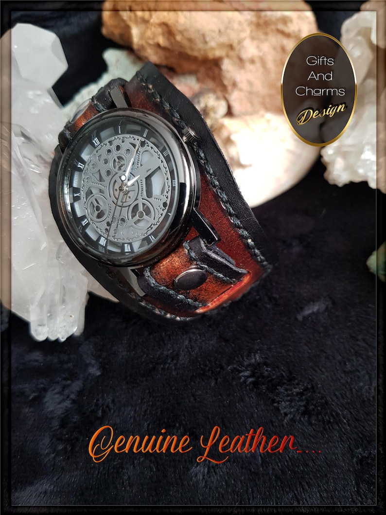May include: A black leather watch band with a brown leather cuff. The watch face is silver with a skeleton design and black hands. The band has a black stitching detail. The text "Genuine Leather..." is visible at the bottom of the image. The text "Gifts And Charms Design" is visible in the upper right corner of the image.