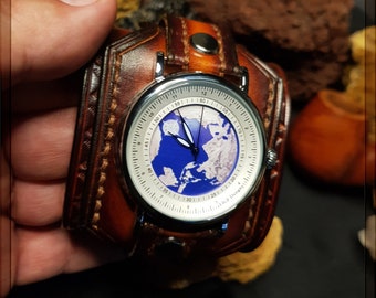 Un reloj de pulsera único: nuestra creación de correa de cuero hecha a mano con su original esfera del globo terraqueo.