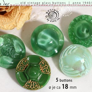 May include: Five vintage green glass buttons, circa 1940-1960, with various designs. One button has gold-colored filigree, and another has a swirling pattern. Each button is approximately 0.7 inches in diameter.