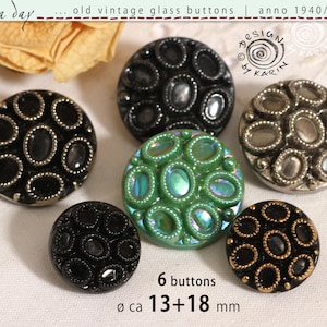 May include: A collection of six old vintage glass buttons in shades of black, silver, and green. Each button has an oval design and a metallic border. The buttons measure approximately 13-18 mm in diameter. The image text reads "old vintage glass buttons | anno 1940/50/60".