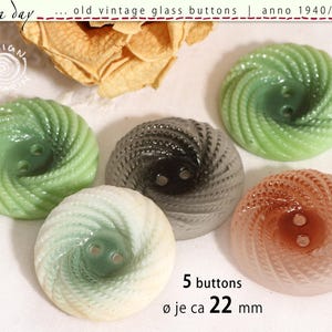 May include: Five vintage glass buttons in shades of green, gray, and peach. Each button has a spiral design and two holes. The buttons are approximately 0.87 inches in diameter. Text on the image reads "old vintage glass buttons" and "5 buttons".