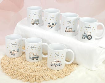 May include: Set of six white ceramic mugs with gold star accents and various vehicle illustrations. Each mug features a different name, including Leonard, Gabriel, Emily, Matthew, Lenny, and Luna.