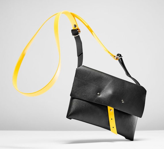 black bag with yellow strap