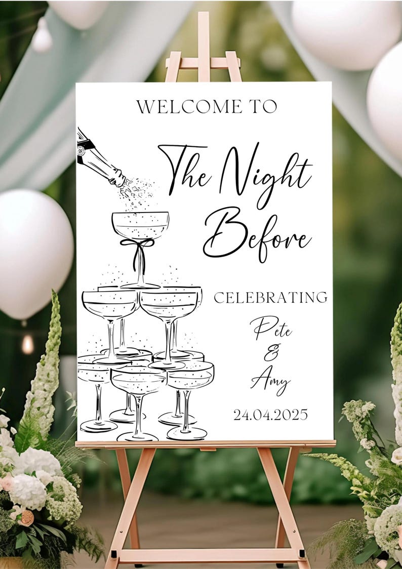 May include: A white rectangular wedding welcome sign featuring black line art of a champagne bottle pouring into a stacked tower of six coupe glasses. The text reads: WELCOME TO The Night Before CELEBRATING Pete & Amy 24.04.2025 in black font.