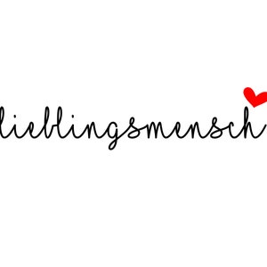 May include: A black and white handwritten word "lieblingsmensch" with a small red heart above it.