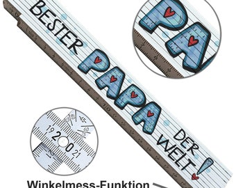 May include: A white wooden ruler with a blue and red design. The ruler features the words "Bester Papa der Welt!" and has a protractor on the side.