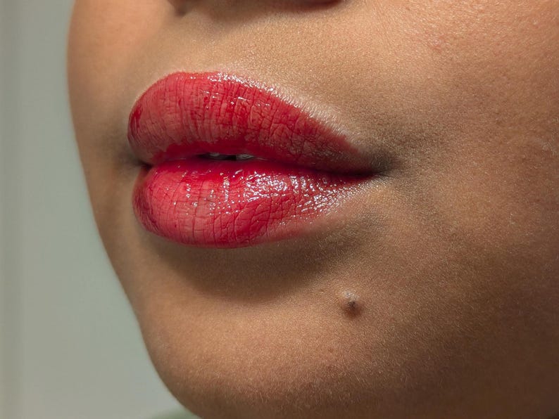 holiday lip gloss a deep cherry red