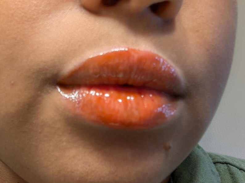 Spiced lip gloss deep orange brown color