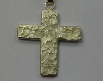 One-of-a-kind cross "hammered"