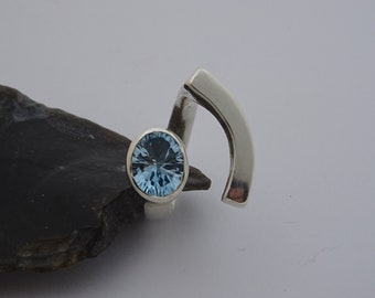 Wide silver ring polished with blue topaz 10 x 8 mm