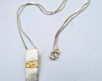 Bi-color pendant with 585 yellow gold inlay