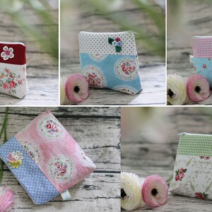 May include: Five different small zippered pouches with floral patterns. Each pouch has a different fabric on the top and bottom. The pouches are all about 4 inches wide and 5 inches tall.