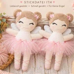 May include: Two plush dolls with light brown hair styled in buns, featuring embroidered facial features, pink blush, white tops, light blue wings, and pink tulle skirts. The dolls wear pink ballet slippers with crisscross ribbon detailing.