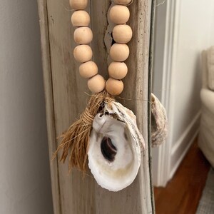Oyster shell blessing beads, oyster shell and wood bead ornament.