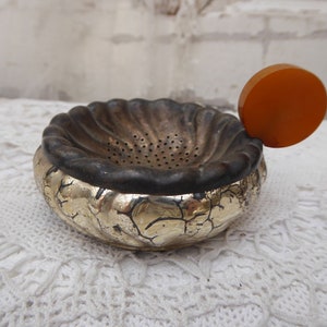 colador de té art deco, plateado
