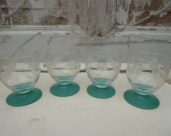 4 vintage shot glasses