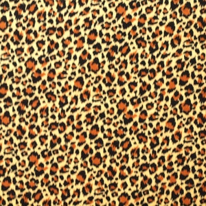 Könnte beinhalten: Nahaufnahme eines Stoffes mit Leopardenmuster. Der Stoff ist hellbeige mit braunen und schwarzen Flecken.