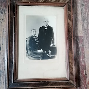 Old photo in frame ancient photo grandma and grandpa portrait