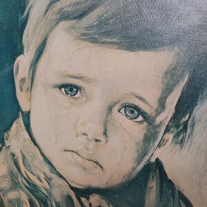 Vintage picture of a sad boy with frame