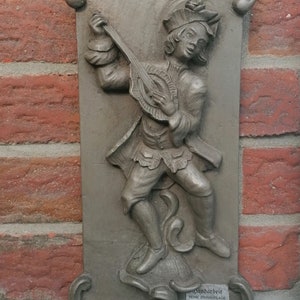 Relief mural tin