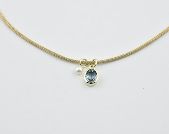 Knitted necklace blue topaz, pearl