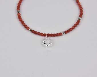 Coral bracelet with Buddha head