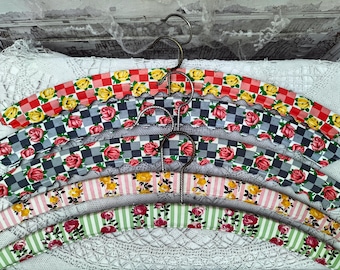 5 coat hangers, plastic-covered, rose pattern