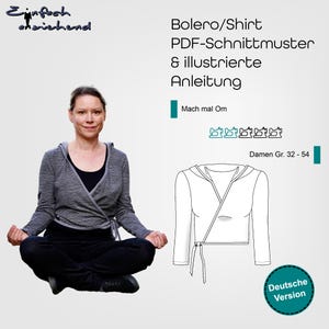 May include: A digital download pattern for a hooded wrap top or shirt. The pattern includes instructions and is available in sizes 32-54. The image shows a woman wearing a grey and white striped version of the top.