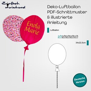 Könnte beinhalten: Ein rosa Stoffballon mit dem Namen "Enola Marie" in gelber Schrift, neben einem gepunkteten Ballon. Das Bild enthält eine Ballonkontur und Text auf Deutsch: "Deko-Luftballon PDF-Schnittmuster & illustrierte Anleitung". Die Maße sind 34x22,5 cm.