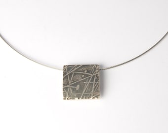 Rectangular pendant with structure