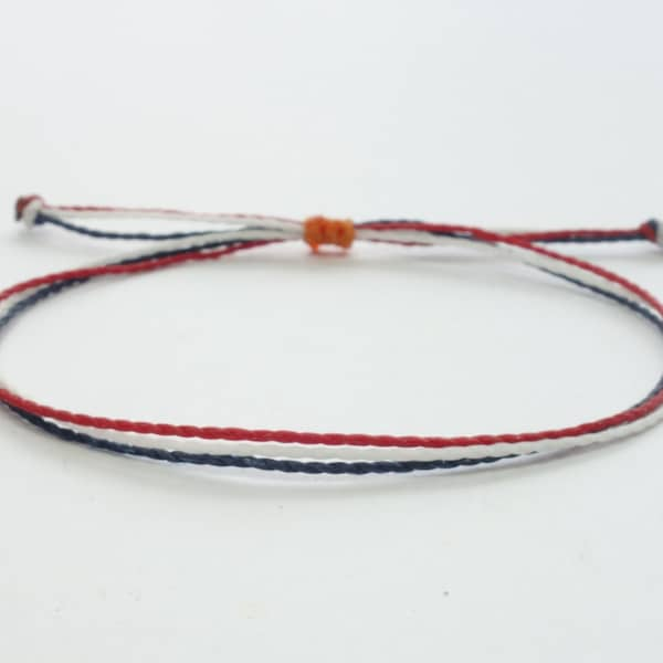 Bracelet réglable imperméable rouge, blanc et bleu avec un noeud coulissant orange. Bracelet ou chaîne de cheville représentant le drapeau des Pays-Bas pour homme et femme.