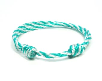 Handmade Green White Cord Boho Friendship Bracelet for men and women, adjustable and waterproof.