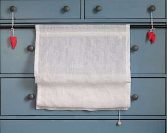 white Roman blinds made of transparent linen in the Scandinavian style, made-to-measure linen blinds